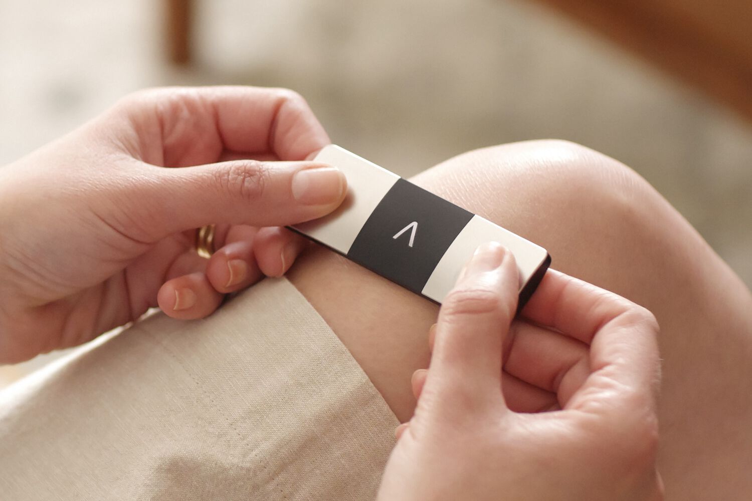 Person using personal EKG machine